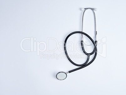 black medical stethoscope on a white background