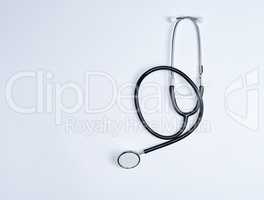 black medical stethoscope on a white background