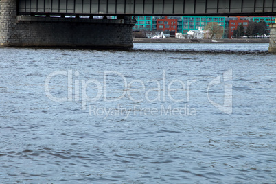 River under bridge in center of Riga.