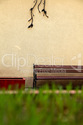 Bench at the wall in Riga city.