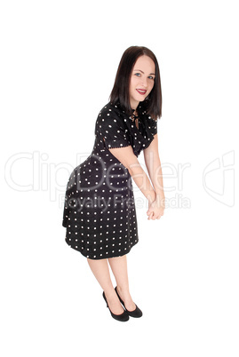 Beautiful woman standing in an pock dot dress