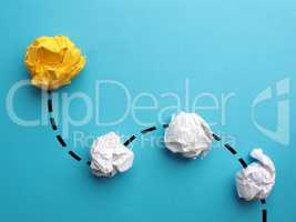 Creativity concept with crumpled yellow paper