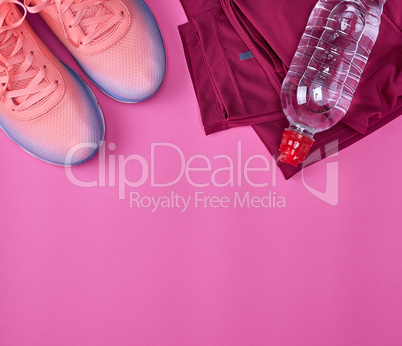 femal sports sneakers and water bottle