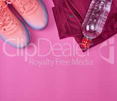 femal sports sneakers and water bottle