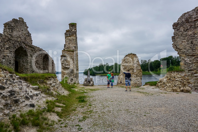 Koknese castle ruins. Tourists take pictures at old castle ruins