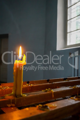 Burning candle at Koknese Evangelical Lutheran Church.