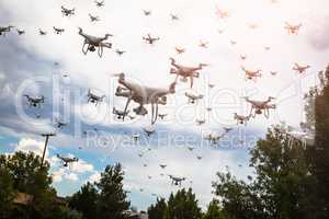 Dozens of Drones Swarm in the Cloudy Sky