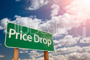 Price Drop Green Road Sign Aginst Sky