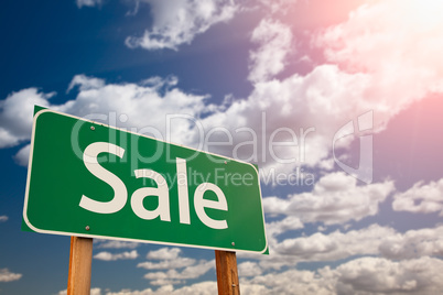 Sale Green Road Sign Aginst Sky