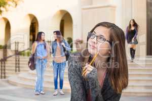Mixed Race Young Female Student Walking On Campus