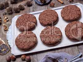 chocolate round biscuit on an iron plate