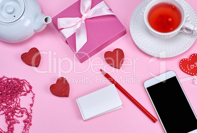 empty white paper business cards, smartphone and herbal tea on a