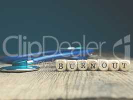 The word burnout on small wood blocks