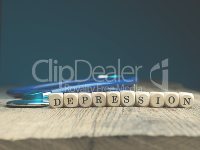 The word depression on wooden blocks