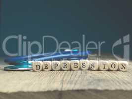 The word depression on wooden blocks