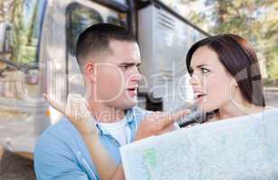 Young Lost and Confused Military Couple Looking at Map by RV