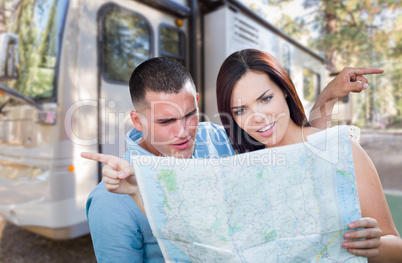 Young Lost and Confused Military Couple Looking at Map by RV