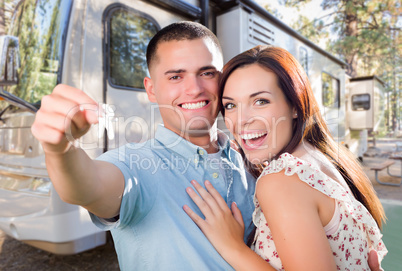 Young Military Couple Holding In Front of New RV