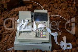 Old cash register with cash register tape.