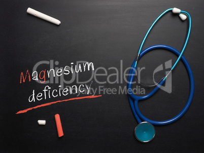 The words Magnesium deficiency on a chalkboard
