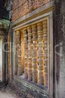 Stone pillar window decor in Banteay Samre temple in Cambodia