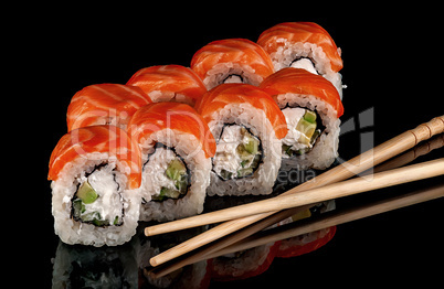 Sushi rolls Philadelphia with chopsticks