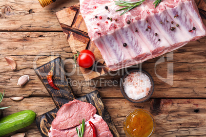 Raw meat on wooden board