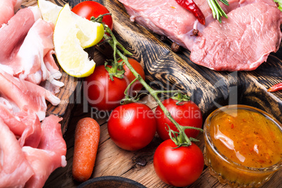 Raw beef meat with vegetables