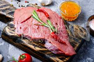 Raw beef meat with vegetables