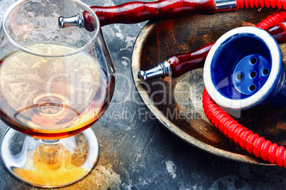 Smoking hookah with brandy flavor
