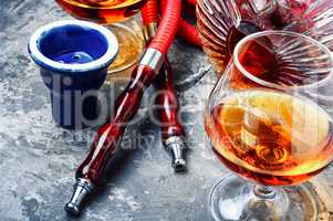 Smoking hookah with cognac flavor