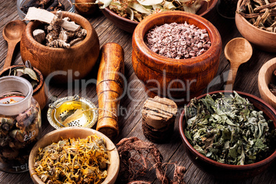 Healing herbs on wooden table