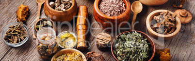 Healing herbs on wooden table