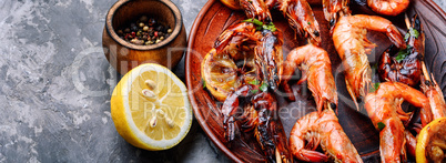 Grilled shrimps skewers with lemon