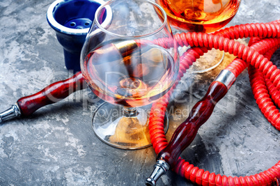 Smoking hookah with cognac flavor