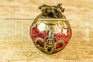 acupuncture needle on antique Chinese paperweight