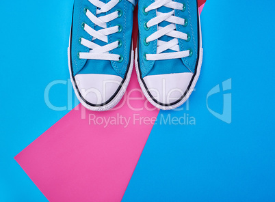 pair of blue textile sneakers