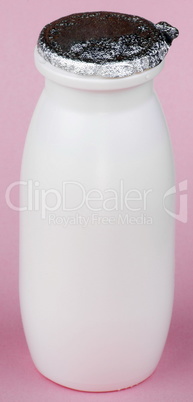 white bottle on pink background