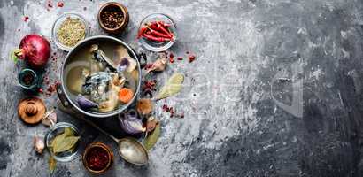 Fish soup in metal pan