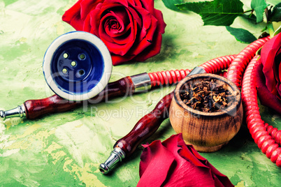 Smoking hookah with rose flavor