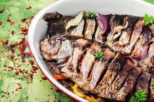 Two grilled fish in baking dish