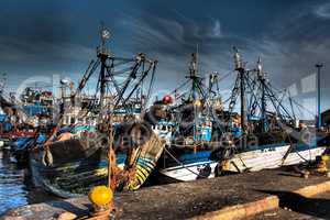 Lots of blue fishing boats in the port of Essaouira, Morocco