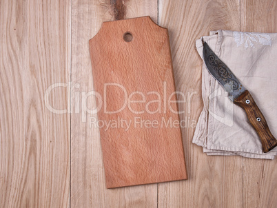 wooden kitchen cutting board and a gray towel