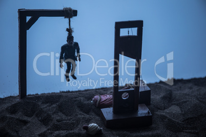 Horror view of hanged man on scaffold and Guillotine at misty evening with fog. Execution (or suicide) conceptual artwork decoration. Horror Halloween concept.