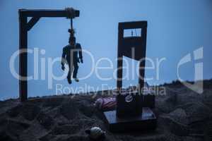 Horror view of hanged man on scaffold and Guillotine at misty evening with fog. Execution (or suicide) conceptual artwork decoration. Horror Halloween concept.