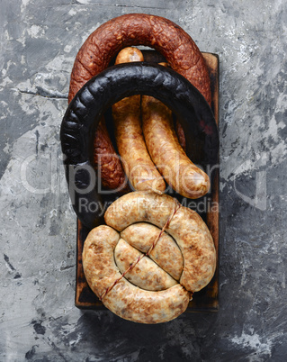 Smoked sausages on cutting board