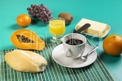 Breakfast with coffee, fruit and bread.