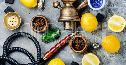 Smoking hookah with lemon flavor