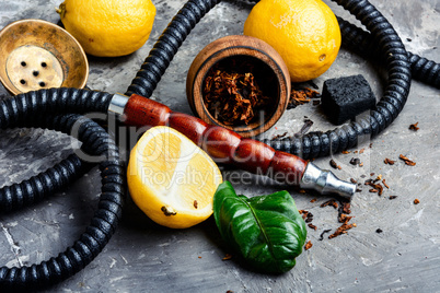 Smoking hookah with lemon flavor