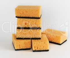 stack of yellow kitchen sponges for washing dishes